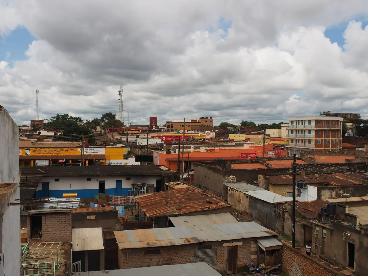 Rooftops of Gulu town under a cloudy sky
